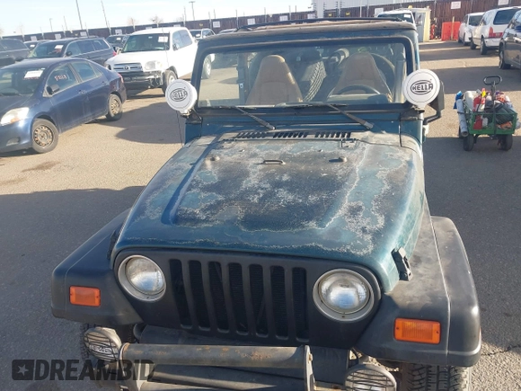 1997 Jeep Wrangler SE with VIN 1J4FY29PXVP409498, listed as a IAAI auction lot 41818698 with 150,086 mi miles. Bid and sale history available at carsss.com. Image 6.