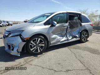 2018 Honda Odyssey Elite z VIN 5FNRL6H9XJB092774, wystawiony jako Copart lot #53152565 z przebiegiem Nie podano mil oraz Szkoda całkowita • Salvage title. Historia ofert i sprzedaży dostępna na DreamBid. Obrazek 1.
