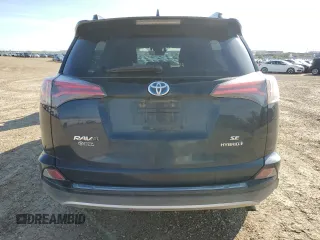 2018 Toyota RAV4 Hybrid SE with VIN JTMJJREV2JD230126, listed as a Copart auction lot 62574005 with 196,846 mi miles and Salvage title. Bid and sale history available at DreamBid. Image 6.