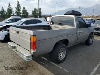 1987 Nissan Hardbody E z VIN JN6ND11SXHW014073, wystawiony jako Copart lot #78956934 z przebiegiem 381 885 mil mil oraz Szkody całkowita. Historia ofert i sprzedaży dostępna na DreamBid. Obrazek 3.