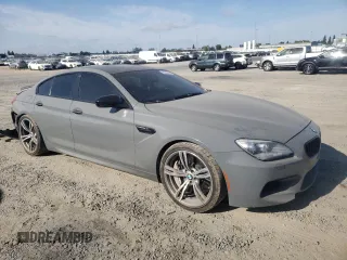 2015 BMW M6 z VIN WBS6C9C52FD467461, wystawiony jako Copart lot #68057084 z przebiegiem 130 687 mil mil oraz Szkoda całkowita • Salvage title. Historia ofert i sprzedaży dostępna na DreamBid. Obrazek 4.