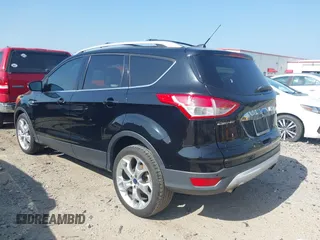 2016 Ford Escape Titanium with VIN 1FMCU0JX5GUC88013, listed as a IAAI auction lot 41933751 with 77,789 mi miles. Bid and sale history available at carsss.com. Image 3.