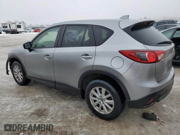 2015 Mazda CX-5 Sport with VIN JM3KE4BEXF0499688, listed as a Copart auction lot 88988095 with 258,460 mi miles and Salvage title. Bid and sale history available at DreamBid. Image 2.