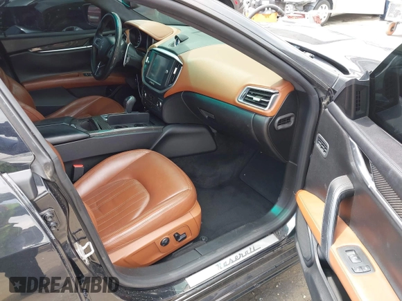 2014 Maserati Ghibli S Q4 with VIN ZAM57RTA0E1101059, listed as a IAAI auction lot 42121292 with 107,901 mi miles and . Bid and sale history available at DreamBid. Image 5.