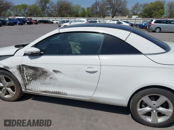 2012 Volkswagen Eos Executive with VIN WVWFW7AH9CV022169, listed as a IAAI auction lot 41795571 with 101,375 mi miles and . Bid and sale history available at DreamBid. Image 14.