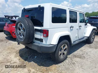 2018 Jeep Wrangler Unlimited Sahara with VIN 1C4BJWEG3JL805263, listed as a IAAI auction lot 42593276 with 96,489 mi miles and . Bid and sale history available at DreamBid. Image 4.