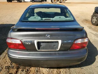 2002 Mazda 626 LX with VIN 1YVGF22C225302664, listed as a Copart auction lot 72603264 with 88,876 mi miles and Salvage Title. Bid and sale history available at carsss.com. Image 6.