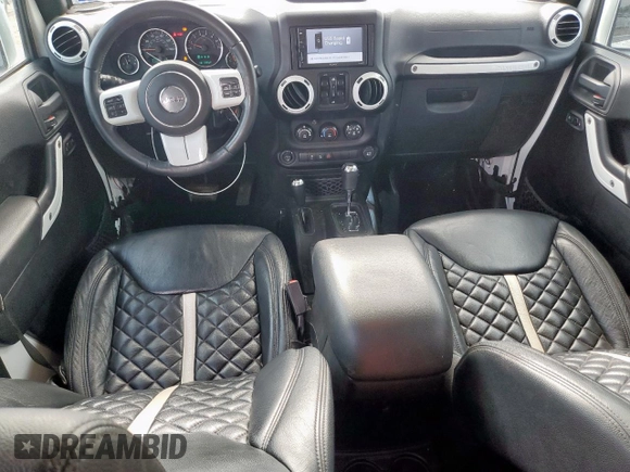 2015 Jeep Wrangler Unlimited Sport with VIN 1C4BJWDG9FL759012, listed as a Copart auction lot 61002465 with 101,395 mi miles and Salvage title. Bid and sale history available at DreamBid. Image 8.