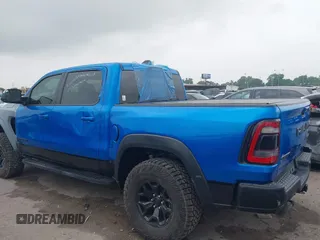 2021 Ram 1500 TRX with VIN 1C6SRFU91MN790158, listed as a IAAI auction lot 42115253 with 30,969 mi miles and . Bid and sale history available at DreamBid. Image 3.