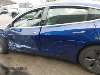 2020 Tesla Model 3 Standard Range Plus with VIN 5YJ3E1EAXLF644679, listed as a IAAI auction lot 41500595 with 53,726 mi miles and . Bid and sale history available at DreamBid. Image 14.