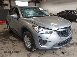 2015 Mazda CX-5 Sport z VIN JM3KE2BE8F0434889, wystawiony jako IAAI lot #42259894 z przebiegiem 298 835 mil mil oraz . Historia ofert i sprzedaży dostępna na DreamBid. Obrazek 1.