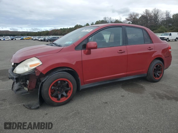 2010 Nissan Versa 1.8 S with VIN 3N1BC1AP4AL371722, listed as a Copart auction lot 72641144 with 128,445 mi miles and Salvage Title. Bid and sale history available at carsss.com. Image 1.