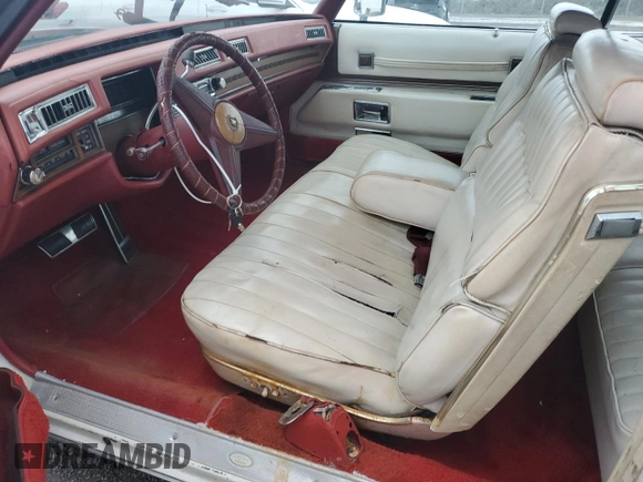 1974 Cadillac Eldorado z VIN 6L67S4Q408046, wystawiony jako Copart lot #77112024 z przebiegiem 97 414 mil mil oraz Szkoda całkowita • Salvage title. Historia ofert i sprzedaży dostępna na DreamBid. Obrazek 7.
