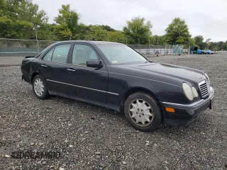 1999 Mercedes-Benz E-Class with VIN WDBJF65H9XA929577, listed as a Copart auction lot 71932364 with 84,806 mi miles and Salvage Title. Bid and sale history available at carsss.com. Image 4.