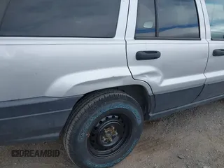 2004 Jeep Grand Cherokee Laredo with VIN 1J4GW48N14C434351, listed as a IAAI auction lot 41860077 with 152,404 mi miles and . Bid and sale history available at DreamBid. Image 6.