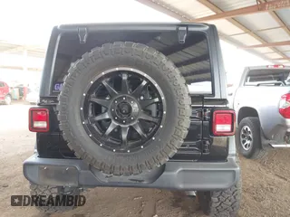 2019 Jeep Wrangler Unlimited Sport S with VIN 1C4HJXDN2KW630780, listed as a IAAI auction lot 41817573 with 56,113 mi miles. Bid and sale history available at carsss.com. Image 16.