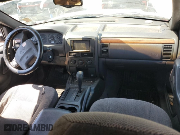 1999 Jeep Grand Cherokee Laredo z VIN 1J4G258SXXC518308, wystawiony jako Copart lot #56636235 z przebiegiem 233 649 mil mil oraz Szkoda całkowita • Salvage title. Historia ofert i sprzedaży dostępna na DreamBid. Obrazek 8.