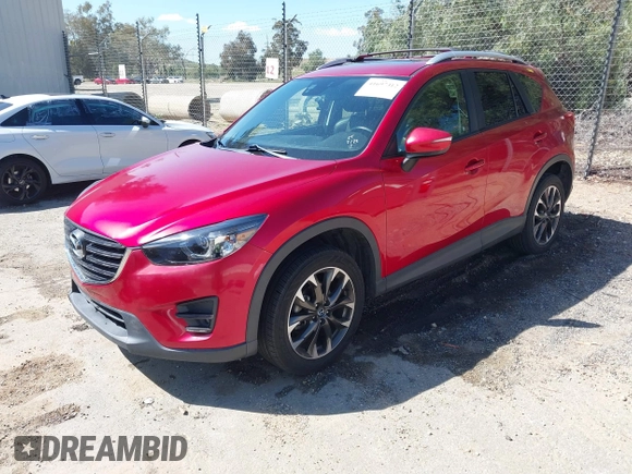 2016 Mazda CX-5 Grand Touring with VIN JM3KE2DY3G0686588, listed as a IAAI auction lot 41697312 with 65,090 mi miles. Bid and sale history available at carsss.com. Image 17.