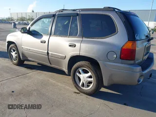 2005 GMC Envoy SLT with VIN 1GKDT13S152373799, listed as a IAAI auction lot 41537512 with 187,750 mi miles. Bid and sale history available at carsss.com. Image 3.