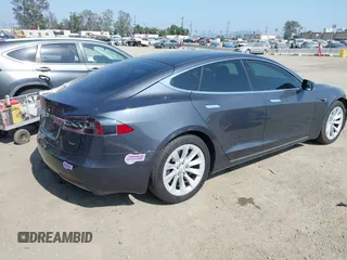 2019 Tesla Model S 75D with VIN 5YJSA1E25KF304371, listed as a IAAI auction lot 42349856 with 64,788 mi miles and . Bid and sale history available at DreamBid. Image 4.