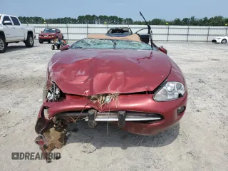 1999 Jaguar XK with VIN SAJGX204XXC038435, listed as a Copart auction lot 64843714 with Not Provided miles and Salvage Title. Bid and sale history available at DreamBid. Image 5.