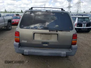 1997 Jeep Grand Cherokee Laredo z VIN 1J4GZ58S4VC502596, wystawiony jako Copart lot #88255865 z przebiegiem Nie podano mil oraz Nie do naprawy • Non repairable. Historia ofert i sprzedaży dostępna na DreamBid. Obrazek 6.