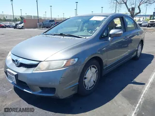 2010 Honda Civic Hybrid with VIN JHMFA3F29AS005350, listed as a IAAI auction lot 41966454 with 145,058 mi miles. Bid and sale history available at carsss.com. Image 2.