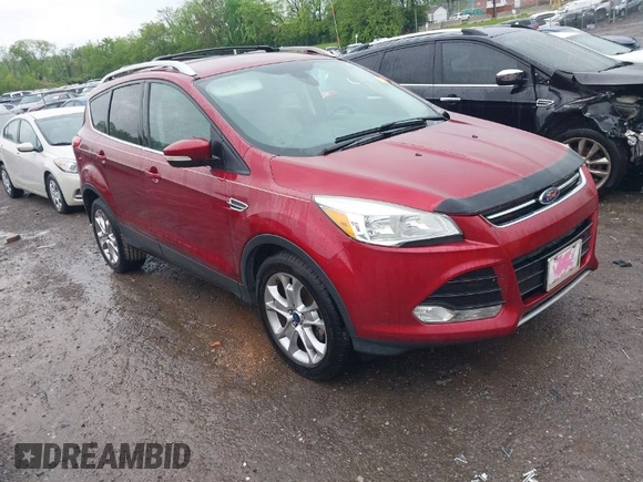 2014 Ford Escape Titanium with VIN 1FMCU0JX3EUD98815, listed as a IAAI auction lot 42078367 with 124,680 mi miles. Bid and sale history available at carsss.com. Image 1.