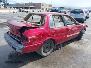 1990 Mitsubishi Mirage z VIN JA3CU26X2LU049259, wystawiony jako IAAI lot #41788912 z przebiegiem Nie podano mil oraz . Historia ofert i sprzedaży dostępna na DreamBid. Obrazek 4.