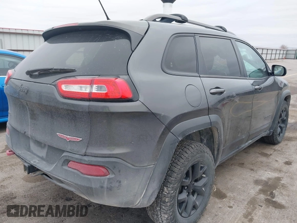 2015 Jeep Cherokee Trailhawk with VIN 1C4PJMBS0FW668730, listed as a IAAI auction lot 41462037 with 83,454 mi miles. Bid and sale history available at carsss.com. Image 4.