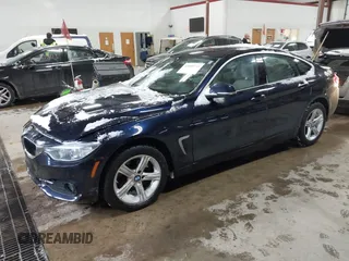 2015 BMW 4 Series 428i xDrive with VIN WBA4A7C57FD414955, listed as a IAAI auction lot 41609214 with 69,125 mi miles and . Bid and sale history available at DreamBid. Image 17.