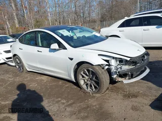 2023 Tesla Model 3 with VIN 5YJ3E1EAXPF572744, listed as a IAAI auction lot 41526101 with 35,765 mi miles and . Bid and sale history available at carsss.com. Image 1.