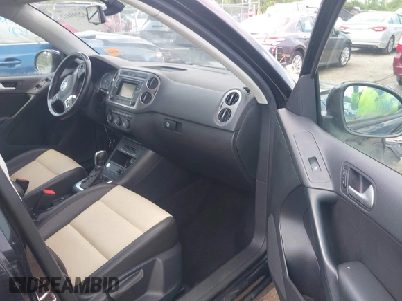 2016 Volkswagen Tiguan S with VIN WVGAV7AX9GW525250, listed as a IAAI auction lot 42393412 with 154,919 mi miles and . Bid and sale history available at DreamBid. Image 5.