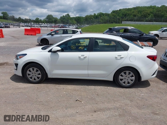 2023 Kia Rio S z VIN 3KPA24ADXPE613557, wystawiony jako IAAI lot #42198794 z przebiegiem 25 275 mil mil oraz . Historia ofert i sprzedaży dostępna na DreamBid. Obrazek 14.