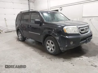 2011 Honda Pilot Touring z VIN 5FNYF4H9XBB089379, wystawiony jako IAAI lot #42394427 z przebiegiem 221 113 mil mil oraz . Historia ofert i sprzedaży dostępna na DreamBid. Obrazek 1.