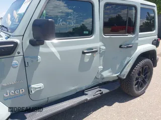 2023 Jeep Wrangler Sahara with VIN 1C4JJXP68PW627007, listed as a IAAI auction lot 42474745 with 57,912 mi miles and . Bid and sale history available at DreamBid. Image 6.