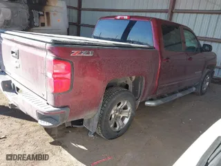 2016 Chevrolet Silverado 1500 LT with VIN 3GCUKREC9GG323309, listed as a IAAI auction lot 41653595 with 130,775 mi miles. Bid and sale history available at carsss.com. Image 4.