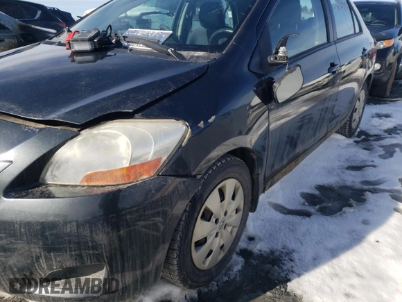 2010 Toyota Yaris with VIN JTDBT4K33A1387279, listed as a Copart auction lot 51213405 with Not Provided miles and Salvage Title. Bid and sale history available at DreamBid. Image 12.
