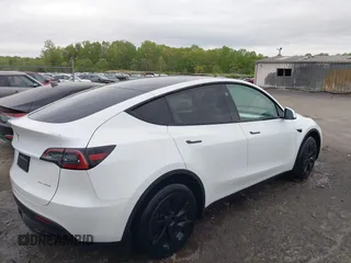 2024 Tesla Model Y Long Range with VIN 7SAYGAEE2RF014315, listed as a IAAI auction lot 42053183 with 36,521 mi miles and . Bid and sale history available at carsss.com. Image 4.