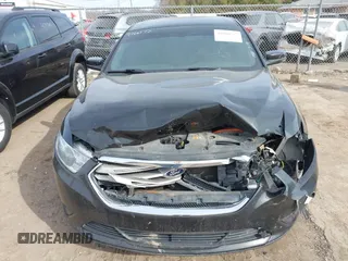 2013 Ford Taurus SEL with VIN 1FAHP2E84DG188503, listed as a IAAI auction lot 41800277 with 215,015 mi miles. Bid and sale history available at carsss.com. Image 12.