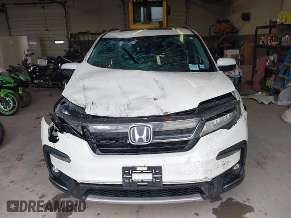 2019 Honda Pilot Elite with VIN 5FNYF6H08KB054725, listed as a IAAI auction lot 40496860 with 91,284 mi miles and . Bid and sale history available at DreamBid. Image 13.