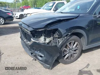 2018 Mazda CX-5 Touring z VIN JM3KFBCM9J0358997, wystawiony jako IAAI lot #42332606 z przebiegiem 93 952 mil mil oraz . Historia ofert i sprzedaży dostępna na DreamBid. Obrazek 6.