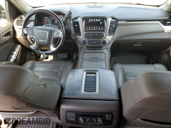 2018 GMC Yukon Denali with VIN 1GKS2CKJXJR217857, listed as a Copart auction lot 62943934 with 122,015 mi miles and Salvage Title. Bid and sale history available at carsss.com. Image 8.