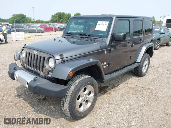 2014 Jeep Wrangler Unlimited Sahara with VIN 1C4BJWEG8EL285843, listed as a IAAI auction lot 42399090 with Not provided miles and . Bid and sale history available at DreamBid. Image 2.