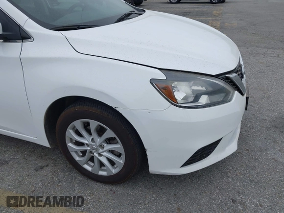 2018 Nissan Sentra S with VIN 3N1AB7AP6JY280214, listed as a IAAI auction lot 42173409 with 142,852 mi miles and . Bid and sale history available at DreamBid. Image 13.