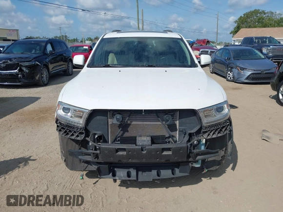 2014 Dodge Durango Limited with VIN 1C4RDJDGXEC323129, listed as a IAAI auction lot 42318727 with 148,451 mi miles and . Bid and sale history available at DreamBid. Image 6.