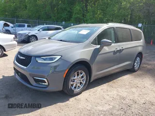 2022 Chrysler Pacifica Touring L with VIN 2C4RC1BG3NR168565, listed as a IAAI auction lot 42150290 with 61,750 mi miles and . Bid and sale history available at DreamBid. Image 2.