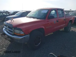 2002 Dodge Dakota SLT z VIN 1B7HG48N42S595562, wystawiony jako IAAI lot #42107671 z przebiegiem 170 379 mil mil oraz . Historia ofert i sprzedaży dostępna na DreamBid. Obrazek 2.