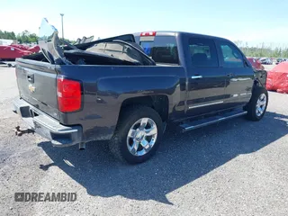 2014 Chevrolet Silverado 1500 LTZ with VIN 3GCUKSEC8EG536076, listed as a IAAI auction lot 41464408 with 133,418 mi miles and . Bid and sale history available at DreamBid. Image 4.