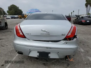 2014 Jaguar XJ Portfolio with VIN SAJWJ2GD2E8V62696, listed as a Copart auction lot 76620494 with 85,487 mi miles and Salvage title. Bid and sale history available at DreamBid. Image 6.